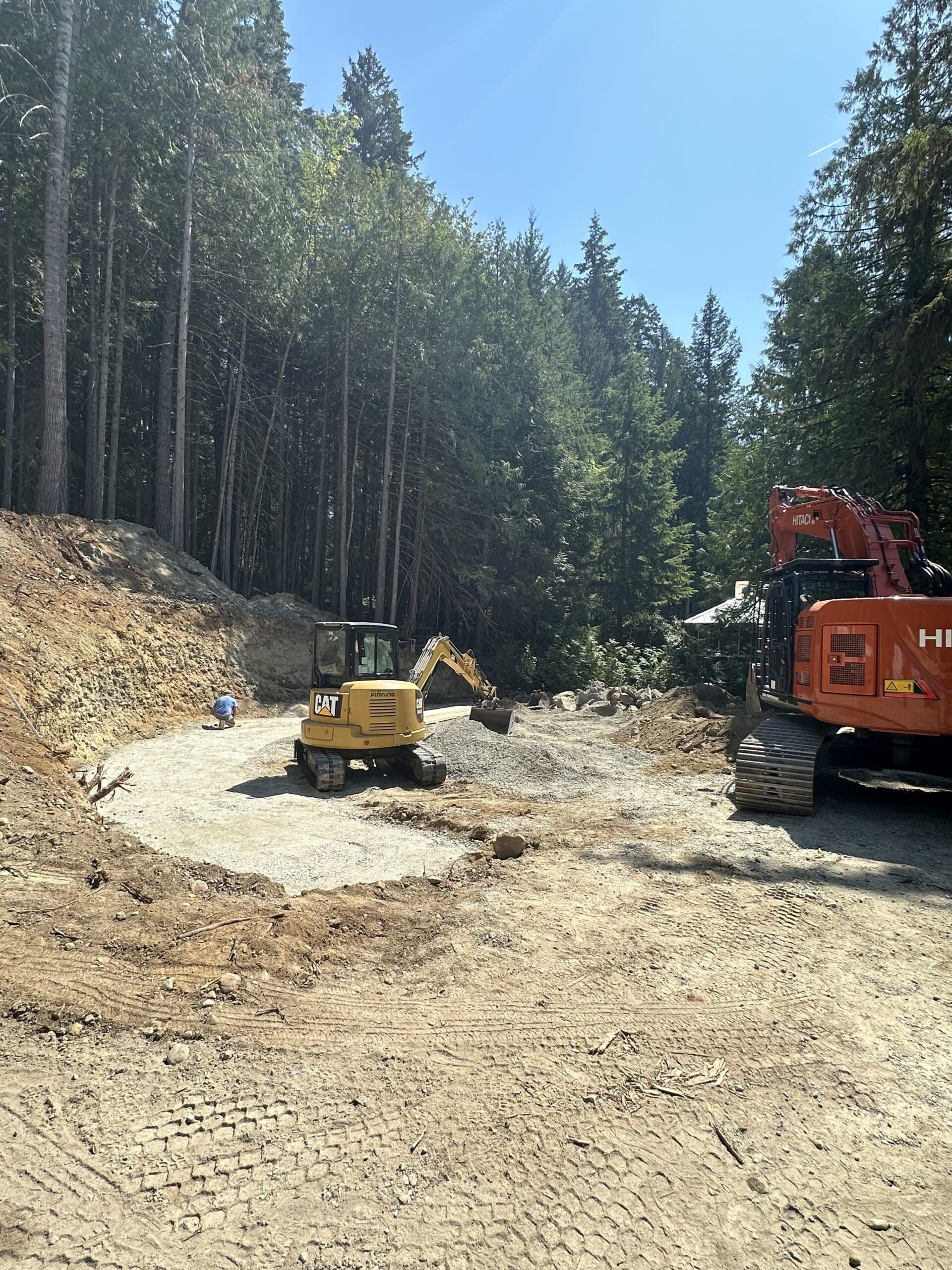 Excavation prep for retaining wall at Shawnigan Lake construction site in Cowichan Valley BC