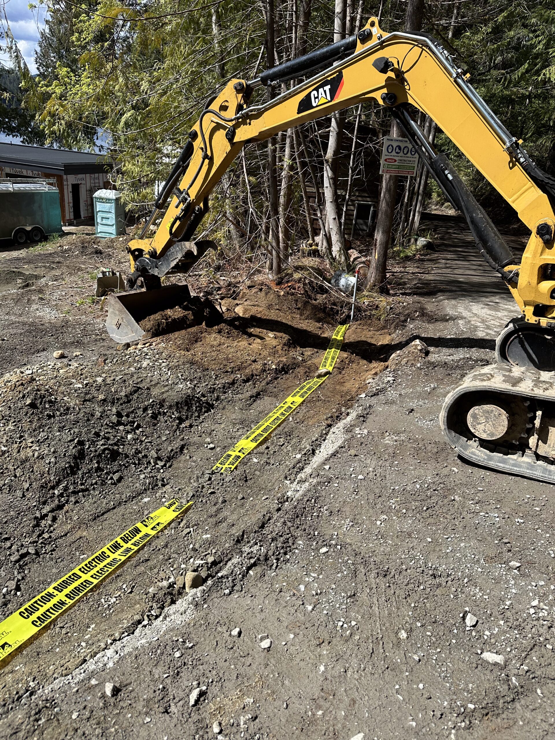 Back filling power trench at Shawnigan construction site in Cowichan Valley BC