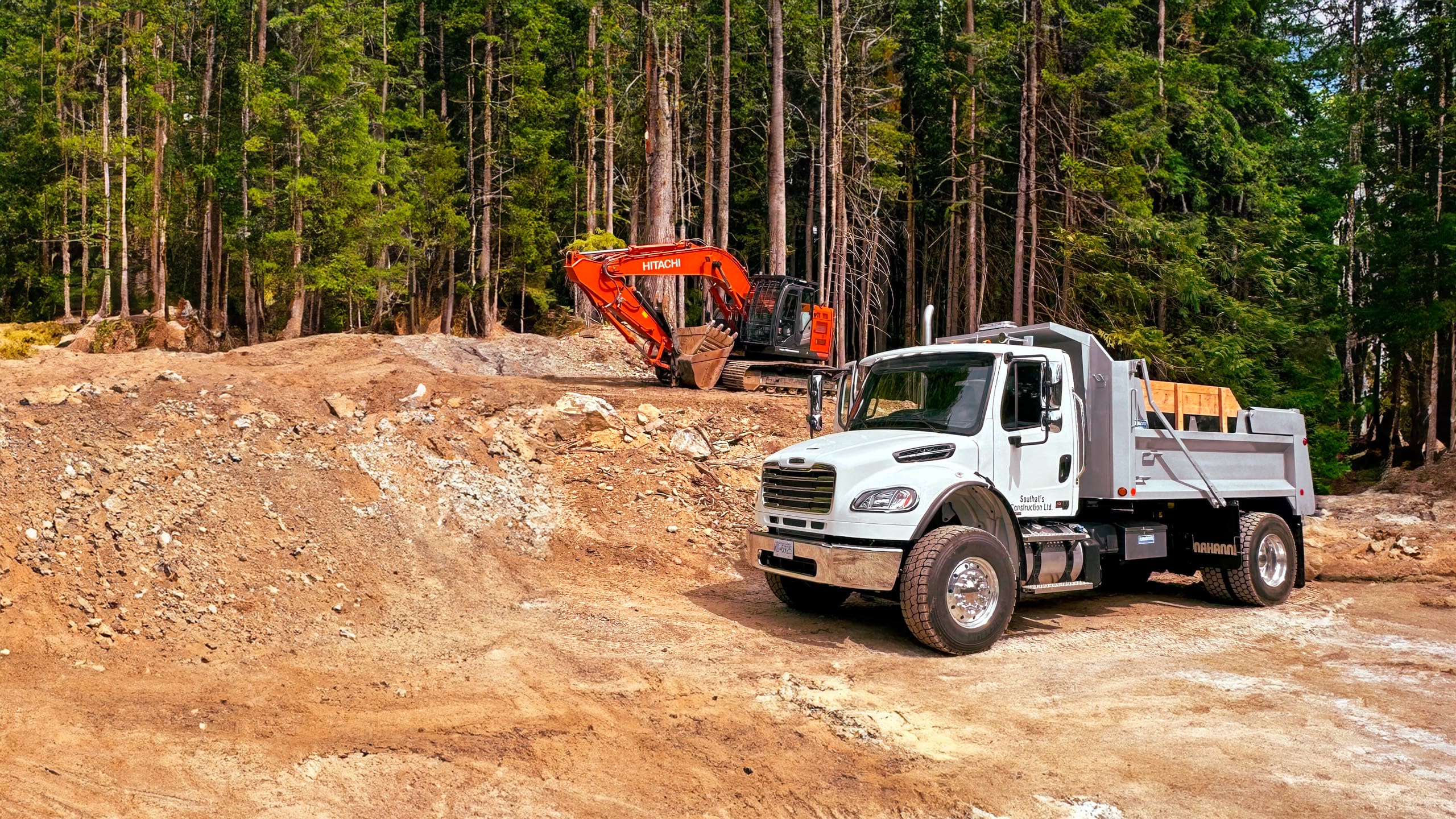 Southall Services dump truck hauling gravel at construction site in Cowichan Valley BC