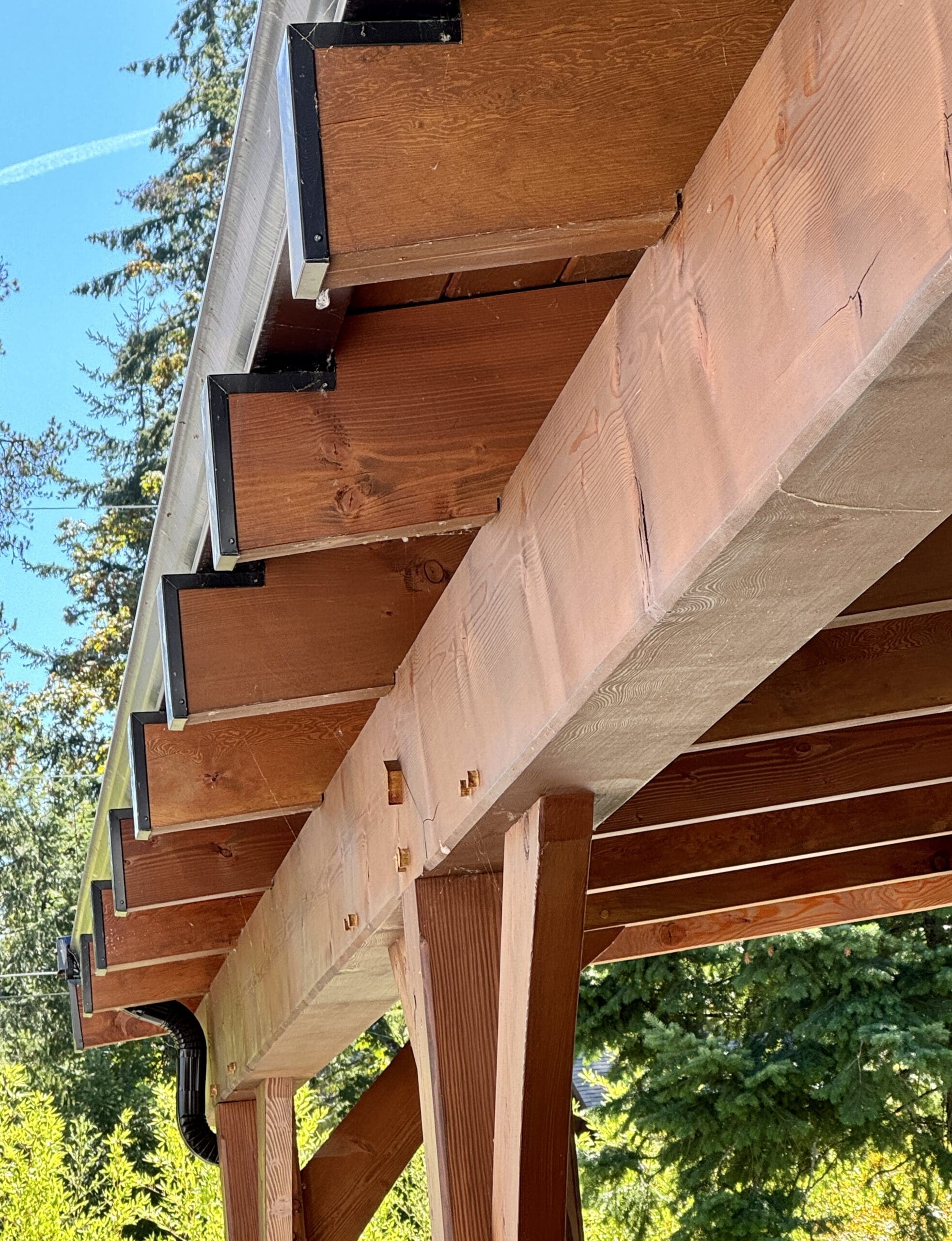 Cat 305.5 mini excavator craning timber beams into place