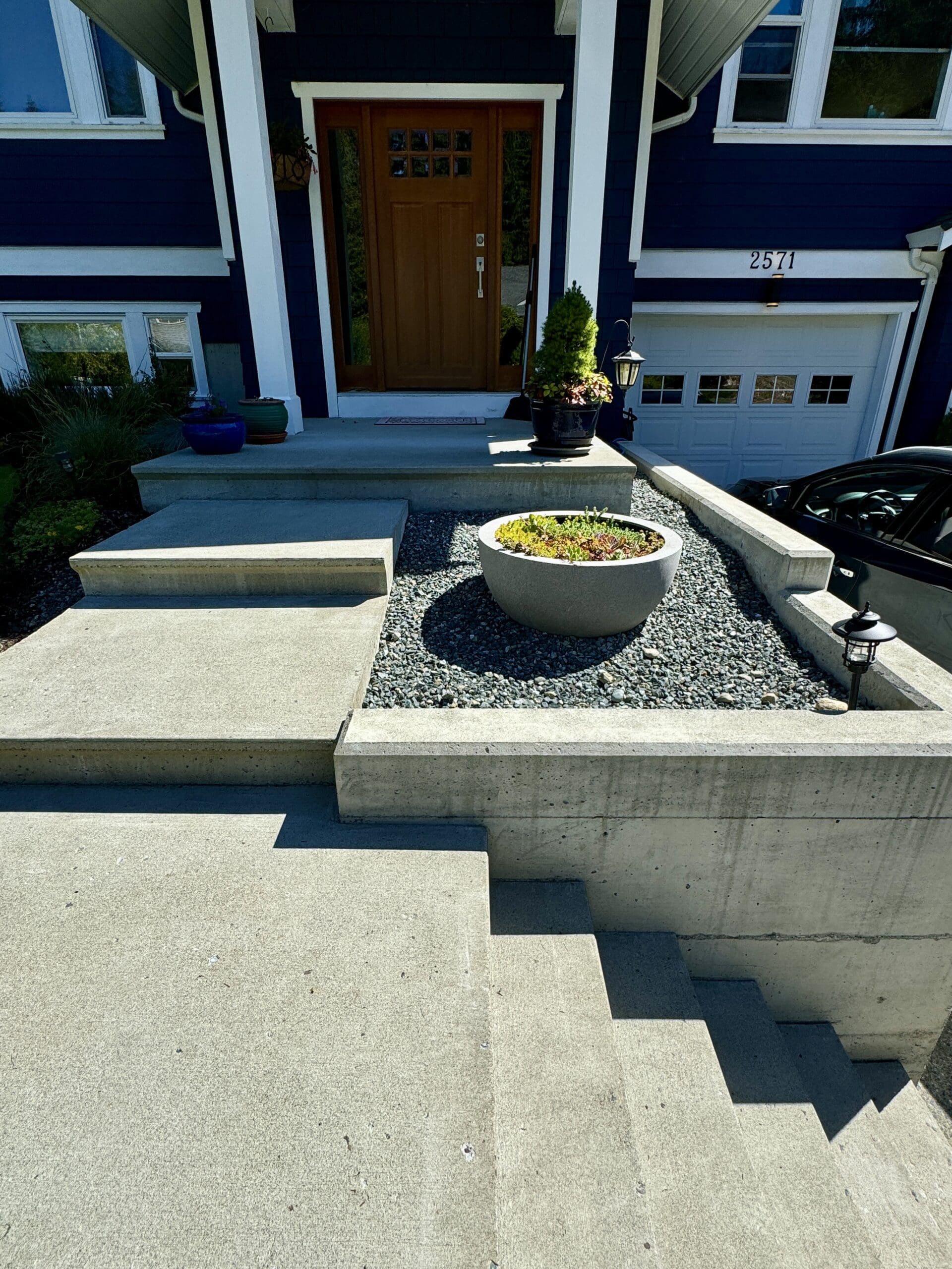 Mill Bay retaining wall project before and after at Kinnoull Crescent