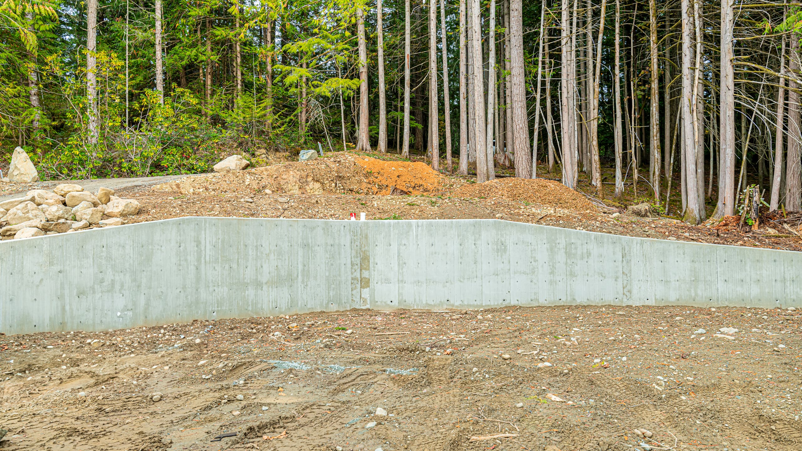 Site preparation and grading with CAT excavator at Cowichan Valley job site
