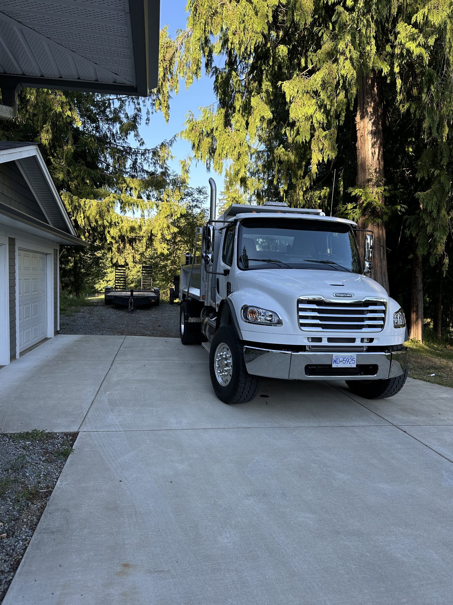 Single axle dump truck delivering materials for landscaping project in Duncan BC