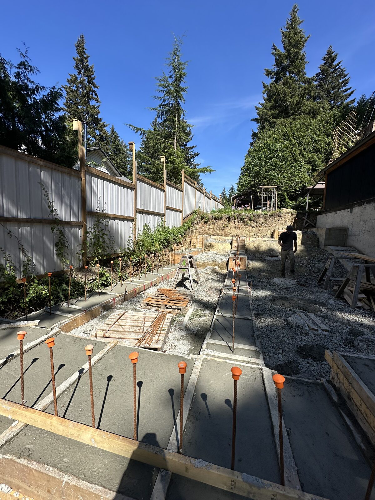 Foundation formwork with reinforcing steel — garage addition and house underpinning project