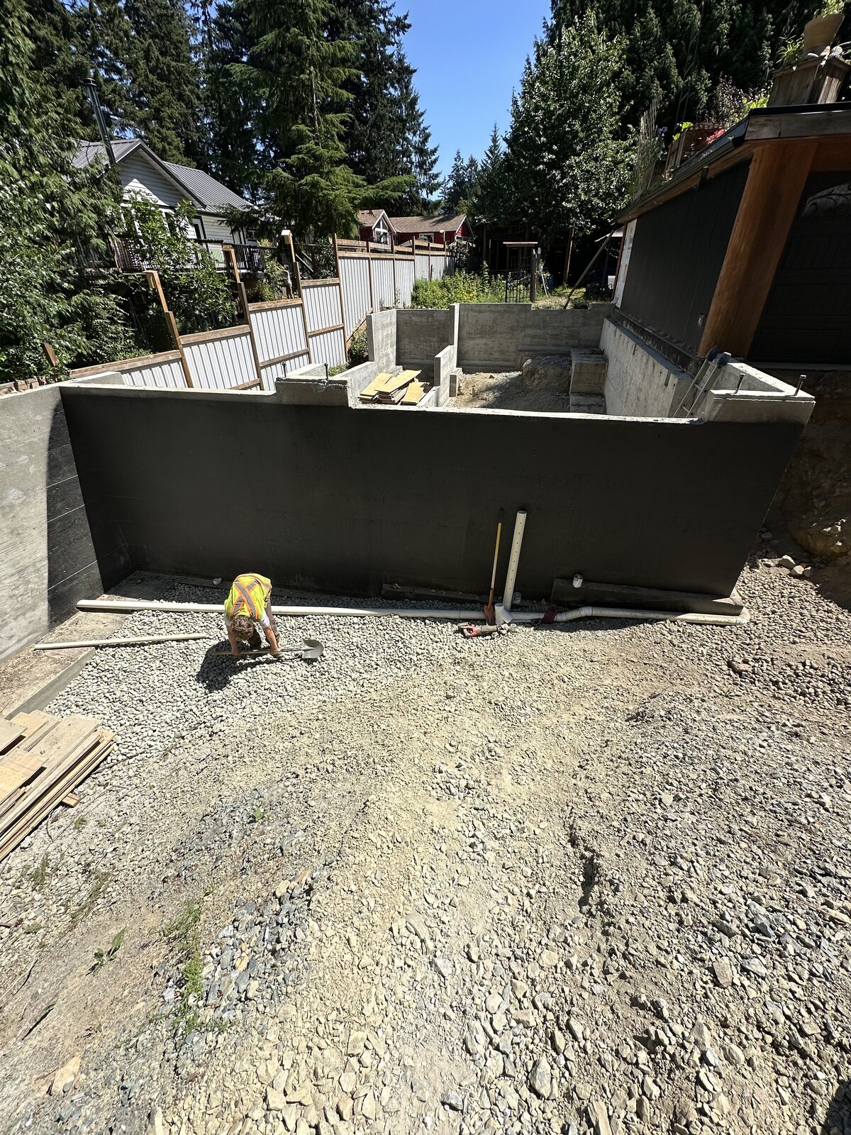 Concrete foundation walls with exterior coating — garage addition and house underpinning project