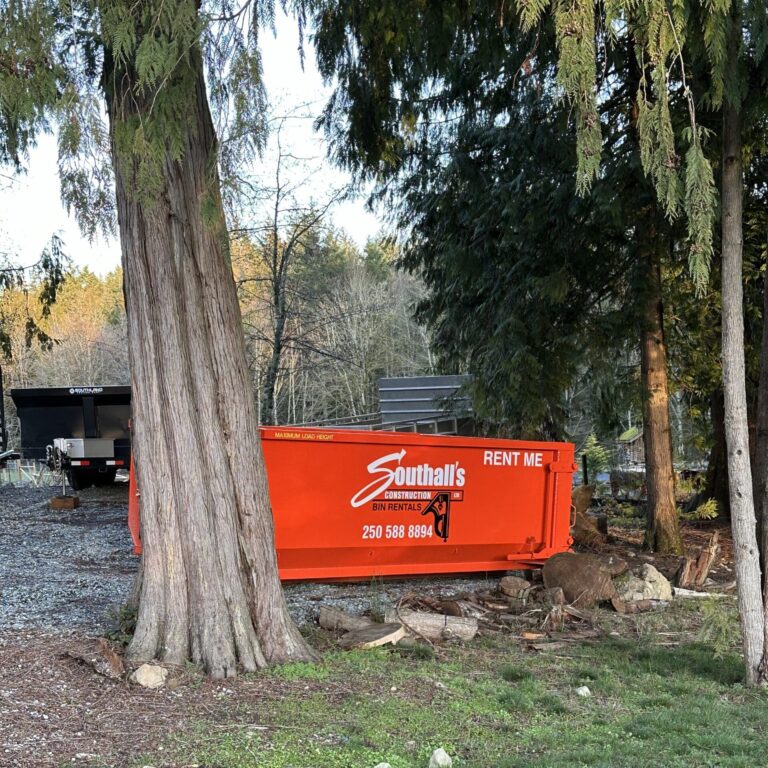 Orange Southall Services rental bin placed on a residential excavation site in the Cowichan Valley